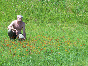Wild man with wild flowers outside our home